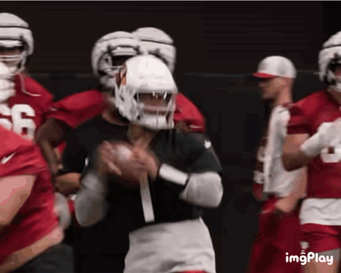 A Football Player Wearing A Number 1 Jersey Is Throwing The Ball GIF