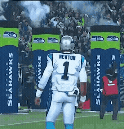 A Football Player Wearing A Number 1 Jersey Is Walking On The Field GIF