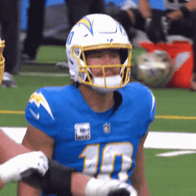 A Football Player Wearing A Number 10 Jersey Stands On The Field GIF
