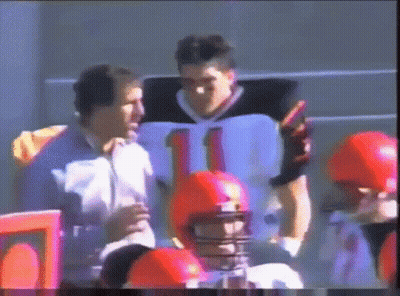 A Football Player Wearing A Number 11 Jersey Talks To Another Player GIF