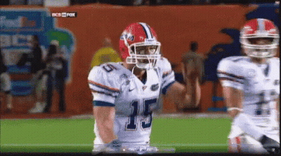 A Football Player Wearing A Number 15 Jersey Stands On The Field GIF