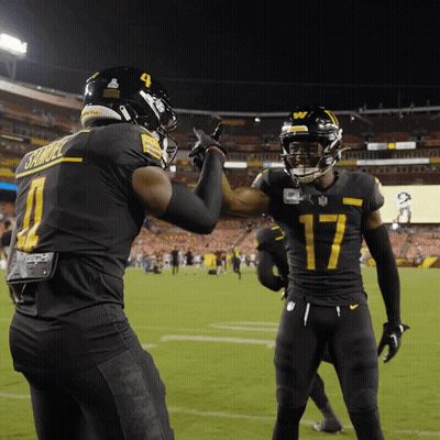 A Football Player Wearing A Number 17 Jersey High Fives Another Player Wearing A Number 4 Jersey GIF