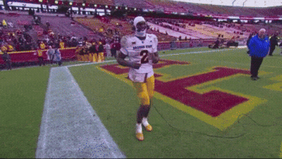 A Football Player Wearing A Number 2 Jersey Is Running On The Field GIF