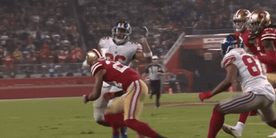 A Football Player Wearing A Number 26 Jersey Runs With The Ball GIF