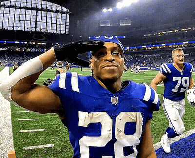 A Football Player Wearing A Number 29 Jersey Salutes GIF