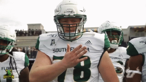 A Football Player Wearing A Number 78 Jersey Applauds GIF