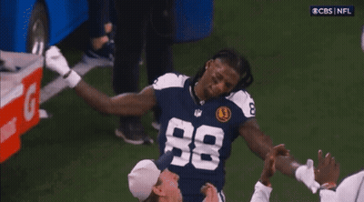 A Football Player Wearing A Number 88 Jersey GIF