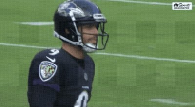 A Football Player Wearing A Number 9 Jersey Stands On The Field GIF