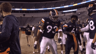 A Football Player Wearing A Number 93 Jersey GIF