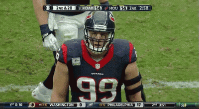 A Football Player Wearing A Number 99 Jersey Stands On The Field GIF