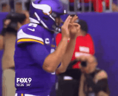 A Football Player Wearing A Purple Jersey With The Number 27 GIF