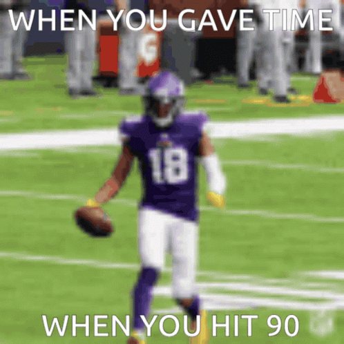 A Football Player Wearing A Purple Uniform With The Number 18 On It GIF