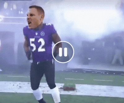 A Football Player Wearing A Purple Uniform With The Number 52 On It GIF