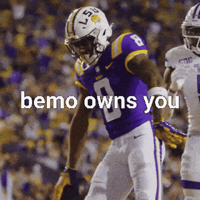 A Football Player Wearing A Purple Uniform With The Number 8 On It GIF
