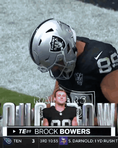 A Football Player Wearing A Raiders Helmet Is On The Field GIF