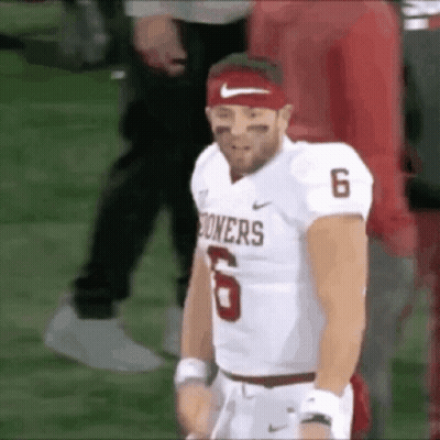 A Football Player Wearing A Red Headband And A White Jersey With The Number 6 On It . GIF