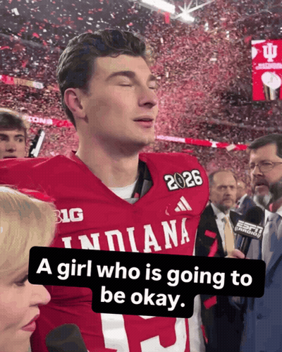 a football player wearing a red indiana jersey