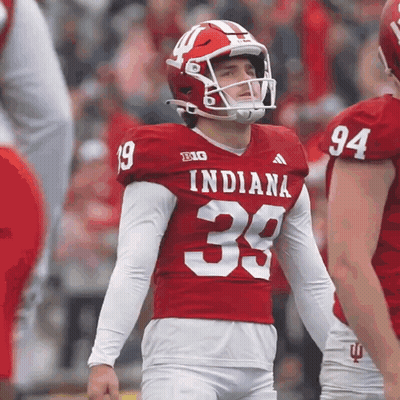 A Football Player Wearing A Red Indiana Jersey GIF