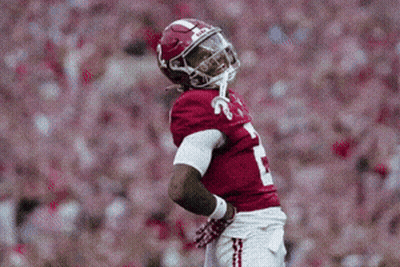 A Football Player Wearing A Red Jersey With The Number 1 On The Front GIF
