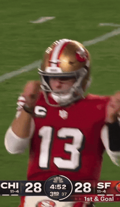 A Football Player Wearing A Red Jersey With The Number 13 GIF