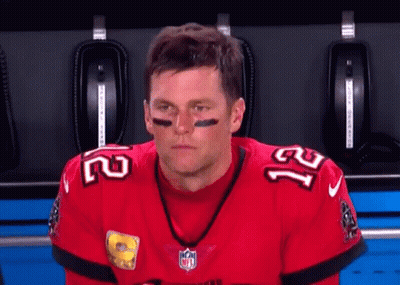 A Football Player Wearing A Red Jersey With The Number 21 On It GIF