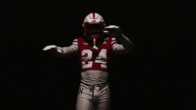 a football player wearing a red jersey with the number 24