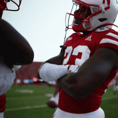 A Football Player Wearing A Red Jersey With The Number 29 GIF