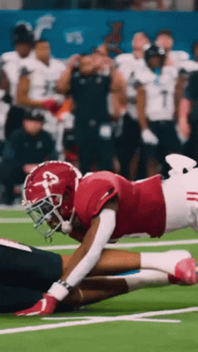 A Football Player Wearing A Red Jersey With The Number 3 On It GIF