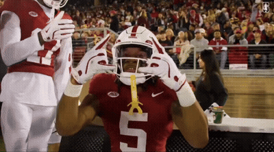 A Football Player Wearing A Red Jersey With The Number 5 GIF