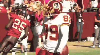 A Football Player Wearing A Red Jersey With The Number 8 On It GIF