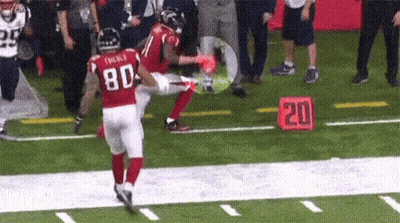 A Football Player Wearing A Red Jersey With The Number 80 On It GIF