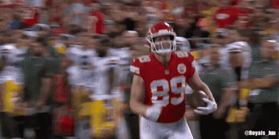 A Football Player Wearing A Red Jersey With The Number 89 On It GIF