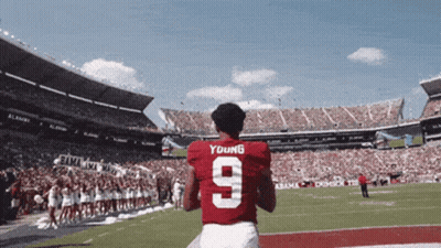 A Football Player Wearing A Red Jersey With The Number 9 GIF