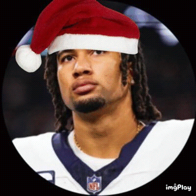 A Football Player Wearing A Santa Hat And A Nfl Jersey . GIF