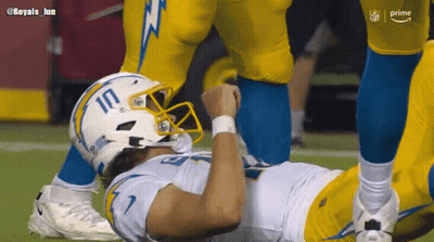 A Football Player Wearing A White Helmet With The Number 10 On It GIF