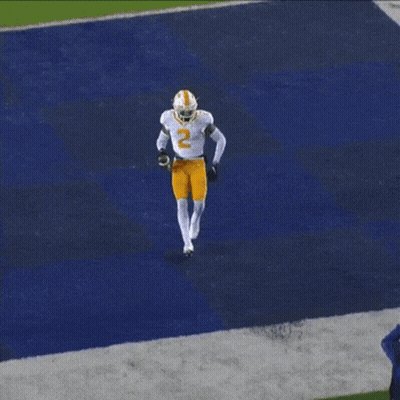 A Football Player Wearing A White Jersey With The Number 2 On It GIF