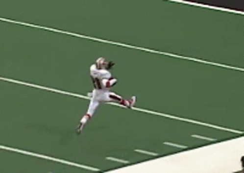 A Football Player Wearing A White Jersey With The Number 31 On It GIF