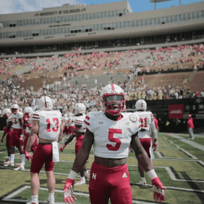 A Football Player Wearing A White Jersey With The Number 5 On It GIF