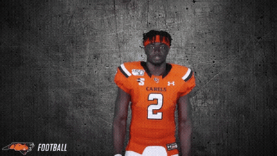 A Football Player Wearing An Orange Jersey With The Number 2 GIF
