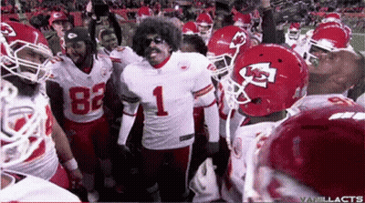 A Football Player Wearing Number 1 Is Surrounded By His Teammates GIF