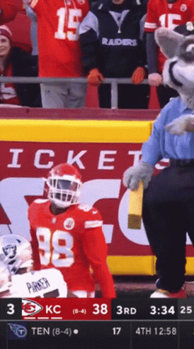 A Football Player Wearing Number 38 Stands In Front Of A Crowd GIF
