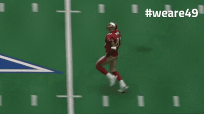 A Football Player Wearing Number 8 Is Running On A Field GIF