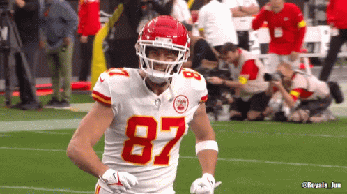 A Football Player Wearing The Number 87 On His Jersey GIF