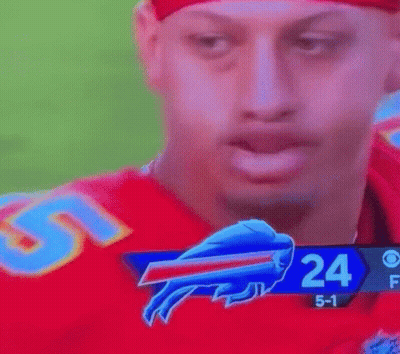 A Football Player With A Buffalo Bills Logo On His Face . GIF