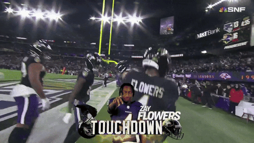 A Football Player With The Name Flowers On The Back Of His Shirt GIF