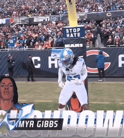 A Football Player With The Name Myr Gibbs On His Jersey GIF