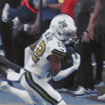 A Football Player With The Name Quake On The Back Of His Uniform GIF