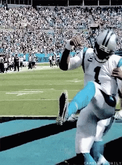 A Football Player With The Number 1 On His Jersey Is Being Lifted Up By Another Player GIF
