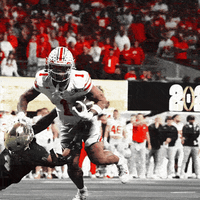 A Football Player With The Number 1 On His Jersey Is Being Tackled By Another Player GIF