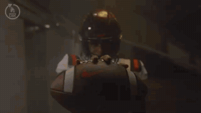A Football Player With The Number 1 On His Jersey Is Kneeling Down Holding A Football . GIF